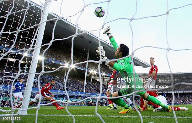 Gareth Barry of Everton scores their first goal on his 600th Premier League appearance past goalkeeper Victor Valdes of Middlesbrough during the...