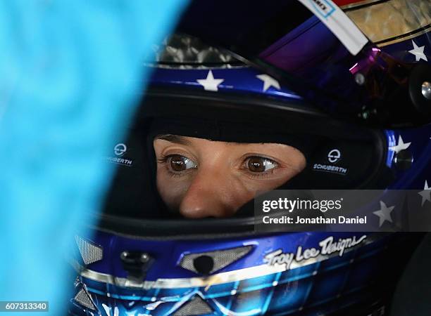 Danica Patrick, driver of the Nature's Bakery/TMNT April O'Neil Chevrolet, sits in her car during practice for the NASCAR Sprint Cup Series Teenage...