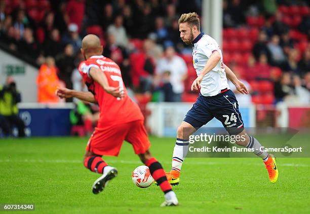 Bolton Wanderers' James Henry under pressure from Walsall's Adam Chambers during the Sky Bet League One match between Walsall and Bolton Wanderers at...