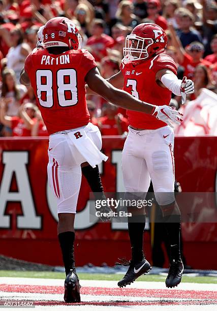 Jawuan Harris of the Rutgers Scarlet Knights celebrates his touchdown with teammate Andre Patton in the first half against the New Mexico Lobos at...