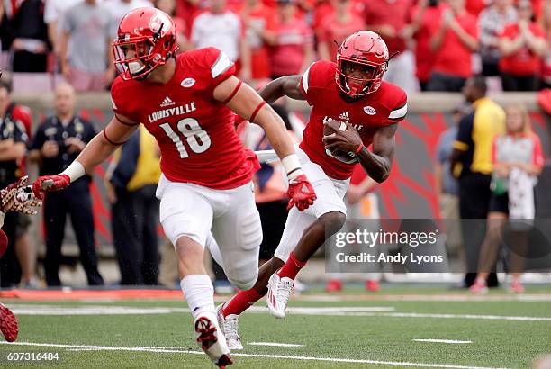 Lamar Jackson of the Louisville Cardinals runs for a touchdown against the Florida State Seminoles at Papa John's Cardinal Stadium on September 17,...