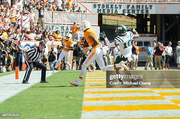 Wide receiver Josh Malone of the Tennessee Volunteers catches a pass in front of cornerback Randy Stites of the Ohio Bobcats for a touchdown at...