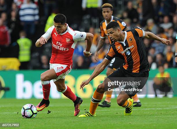 Alexis Sanchez of Arsenal takes on Curtis Davies of Hull during the Premier League match between Hull City and Arsenal at KCOM Stadium on September...