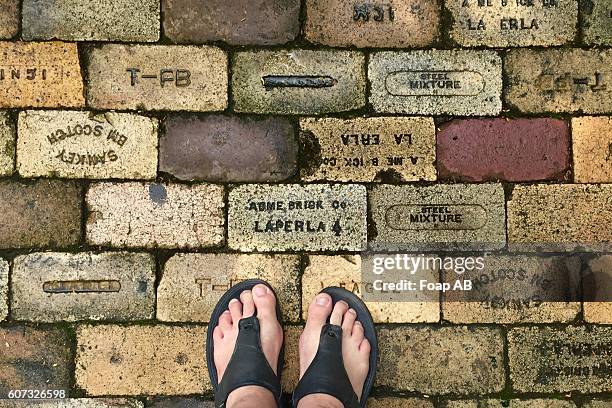 human leg on brick - tagaytay stock pictures, royalty-free photos & images