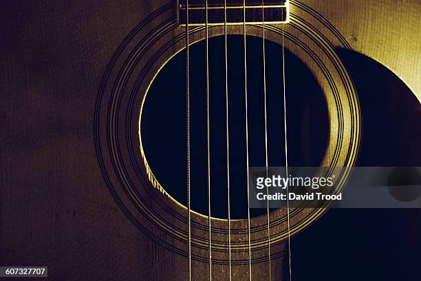 close up of acoustic six string guitar - musical instrument string stock pictures, royalty-free photos & images