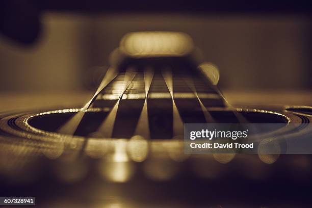 close up of six string acoustic guitar - akustikgitarre stock-fotos und bilder