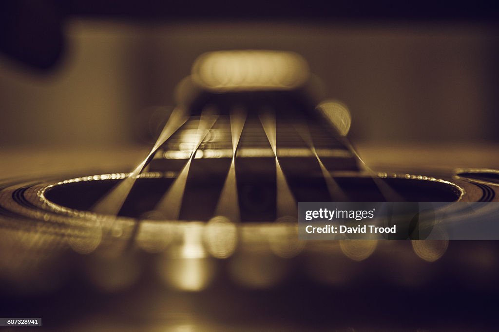 Close up of six string acoustic guitar