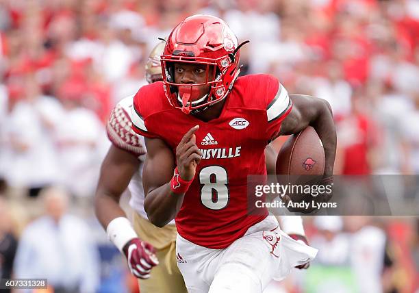 Lamar Jackson of the Louisville Cardinals runs for a touchdown against the Florida State Seminoles at Papa John's Cardinal Stadium on September 17,...