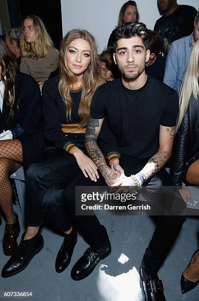 Gigi Hadid and Zayn Malik attend the Versus Versace show during London Fashion Week Spring/Summer collections 2016/2017 on September 17, 2016 in...