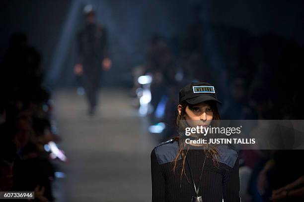 Models present creations by Italian designer Versace's Versus label during the 2017 Spring / Summer catwalk show at London Fashion Week in London on...