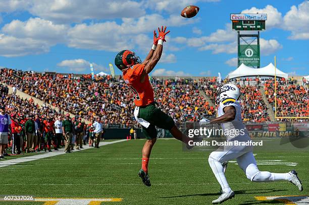 Wide receiver Olabisi Johnson of the Colorado State Rams goes up for a catch in the end zone for a touchdown against the Northern Colorado Bears at...