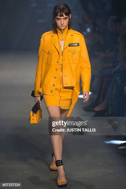 Models present creations by Italian designer Versace's Versus label during the 2017 Spring / Summer catwalk show at London Fashion Week in London on...