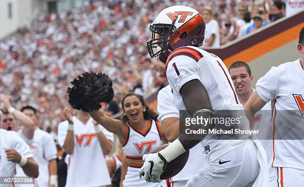 Wide receiver Isaiah Ford of the Virginia Tech Hokies celebrates his touchdown reception against the Boston College Eagles in the first half at Lane...