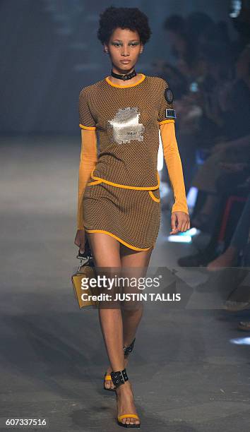 Models present creations by Italian designer Versace's Versus label during the 2017 Spring / Summer catwalk show at London Fashion Week in London on...