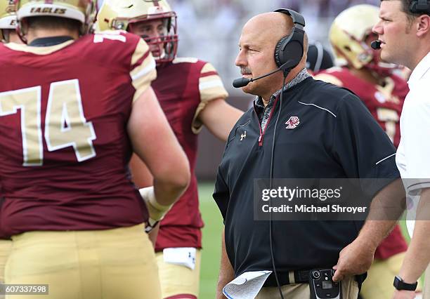 Head coach Steve Addazio of the Boston College Eagles speak to his players in the first half of the game against the Virginia Tech Hokies at Lane...