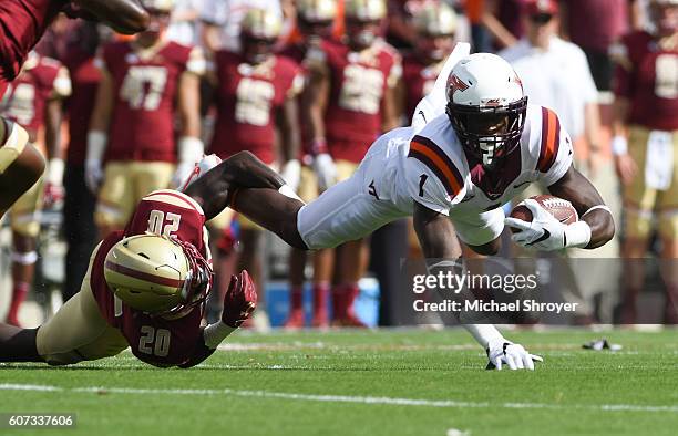 Wide receiver Isaiah Ford of the Virginia Tech Hokies is tackled by defensive back IsaacÊYiadom of the Boston College Eagles in the first half at...