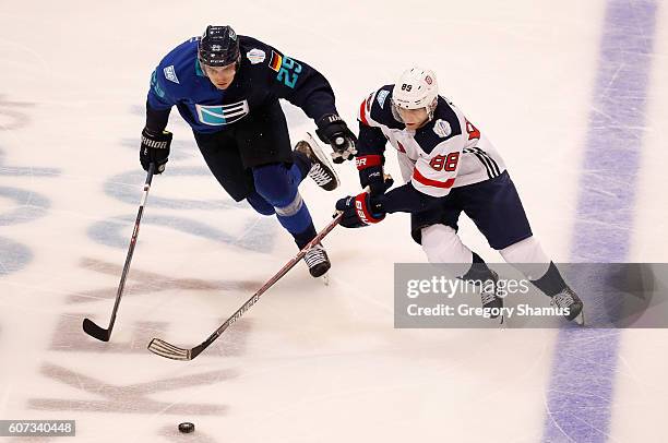 Patrick Kane of Team USA tries to get around the stick of Leon Draisaitl of Team Europe during the second period during the World Cup of Hockey...