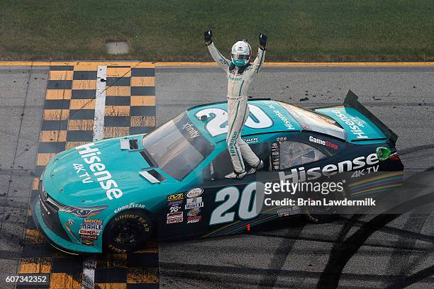 Erik Jones, driver of the Hisense Toyota, celebrates after winning the NASCAR XFINITY Series Drive for Safety 300 at Chicagoland Speedway on...