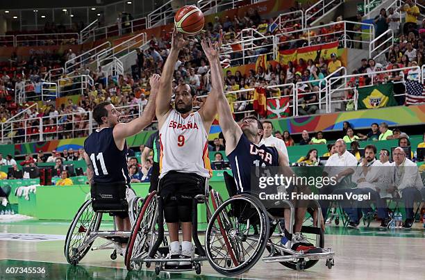 Steve Serio , Ian Lynch of USA and Alejandro Zarzuela of Spain in action during Men's Wheelchair Basketball Gold Medal match between Spain and USA on...