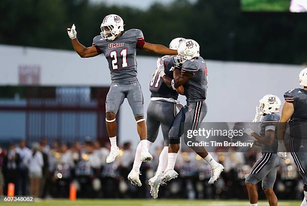 Khary Bailey-Smith of the Massachusetts Minutemen celebrates with teammates after the Minutemen forced a turnover on downs during the fourth quarter...