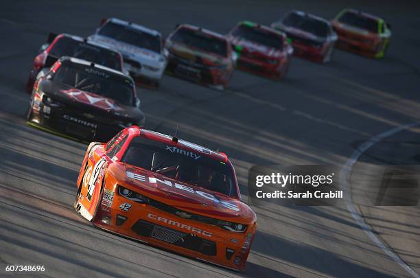 Kyle Larson, driver of the ENEOS Chevrolet, leads a pack of cars during the NASCAR XFINITY Series Drive for Safety 300 at Chicagoland Speedway on...