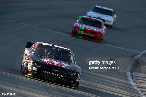 Clint Bowyer, driver of the Morton Buildings Chevrolet, races during the NASCAR XFINITY Series Drive for Safety 300 at Chicagoland Speedway on...