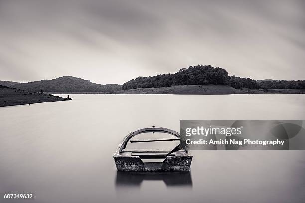 still waters run deep - wooden boat stock pictures, royalty-free photos & images