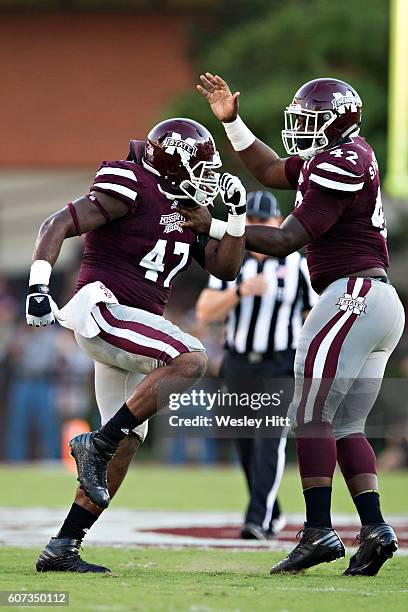 Jefferson celebrates with Marquiss Spencer of the Mississippi State Bulldogs after sacking the quarterback during a game against the South Carolina...