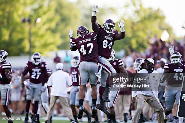 Jefferson celebrates with Nelson Adams of the Mississippi State Bulldogs after sacking the quarterback during a game against the South Carolina...