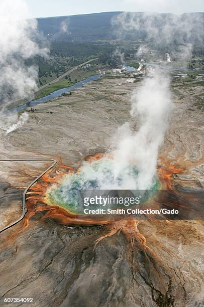 Aerial view of Grand Prismatic Spring and the surrounding landscape, Yellowstone National Park, Wyoming, June 22, 2006. Image courtesy Jim...