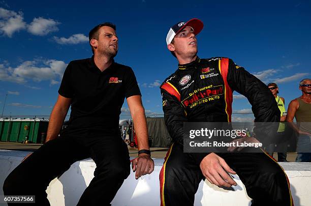 Ryan Sieg, driver of the RSS Racing Chevrolet, talks with a crew member during the NASCAR XFINITY Series Drive for Safety 300 at Chicagoland Speedway...