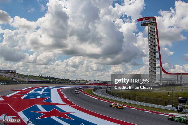 Cars race past a viewing tower during of the IMSA WeatherTech Series race at Circuit of The Americas on September 17, 2016 in Austin, Texas.