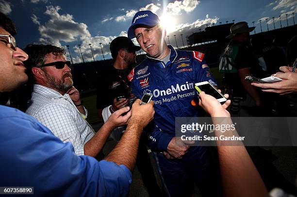 Elliott Sadler, driver of the OneMain Chevrolet, speaks with the media after the NASCAR XFINITY Series Drive for Safety 300 at Chicagoland Speedway...