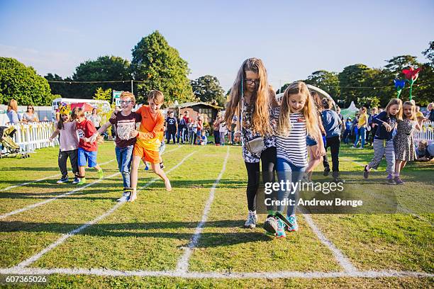 Three Kids Racing Three Legged Race Kids Photos and Premium High Res Pictures - Getty Images