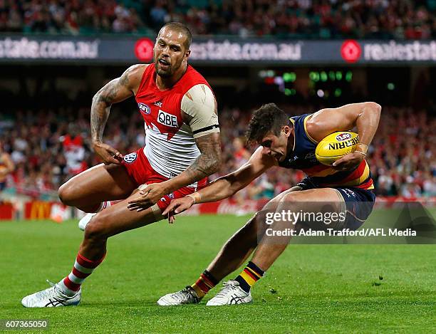 Kyle Hartigan of the Crows is tackled by Lance Franklin of the Swans during the 2016 AFL First Semi Final match between the Sydney Swans and the...