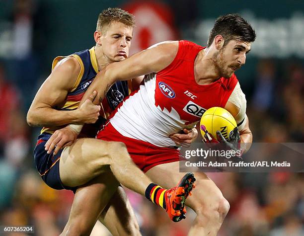 Sam Naismith of the Swans is tackled by David Mackay of the Crows during the 2016 AFL First Semi Final match between the Sydney Swans and the...