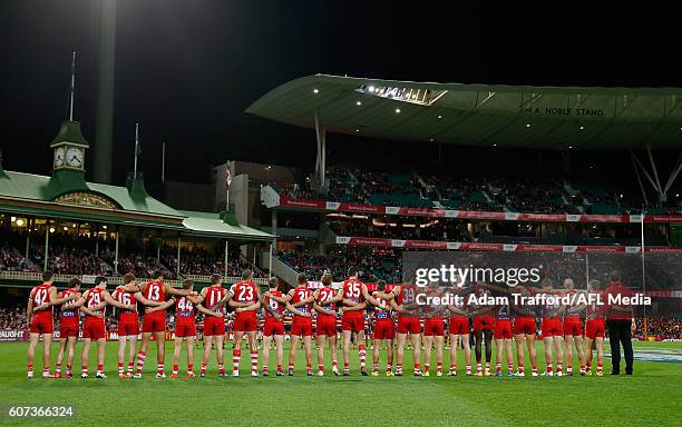 Swans players line up for the national anthem during the 2016 AFL First Semi Final match between the Sydney Swans and the Adelaide Crows at the...