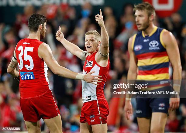 Dan Hannebery of the Swans celebrates a goal with Sam Naismith of the Swans during the 2016 AFL First Semi Final match between the Sydney Swans and...