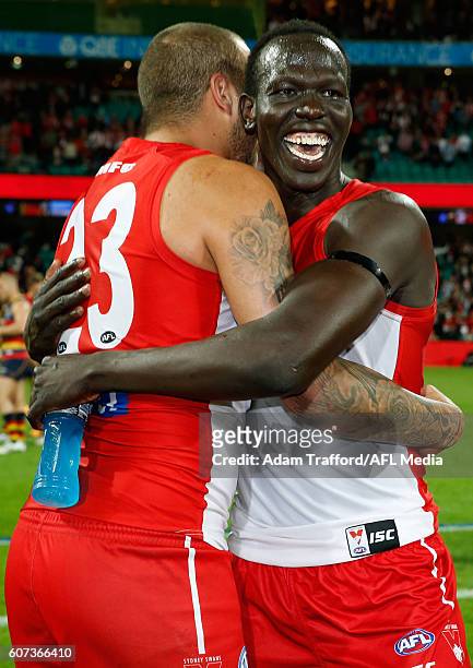 Lance Franklin of the Swans hugs Aliir Aliir of the Swans during the 2016 AFL First Semi Final match between the Sydney Swans and the Adelaide Crows...