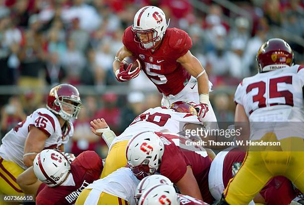 Christian McCaffrey of the Stanford Cardinal battles with Darrien News  Photo - Getty Images