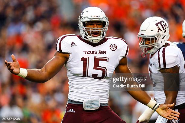 Defensive lineman Myles Garrett of the Texas A&M Aggies celebrates after sacking quarterback Sean White of the Auburn Tigers during an NCAA college...
