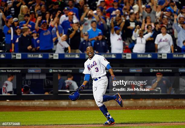 Curtis Granderson of the New York Mets celebrates his twelfth inning game winning home run against the Minnesota Twins at Citi Field on September 17,...