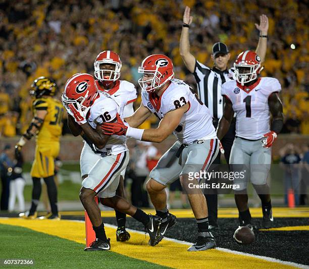 Isaiah McKenzie of the Georgia Bulldogs celebrates his touchdown with Jayson Stanley, Jeb Blazevich and Sony Michel during a game against the...