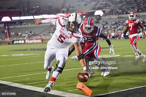 Quarterback Patrick Mahomes II of the Texas Tech Red Raiders reaches for the pylon and scores a touchdown during the game Louisiana Tech Bulldogs on...