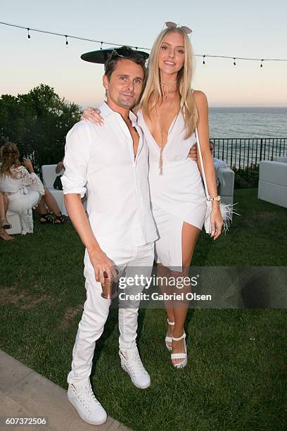 Matt Bellamy of Muse and girlfriend Elle Evans attend the Treats! Magazine 4th Annual White Party Sponsored By Stella Artois on September 17, 2016 in...