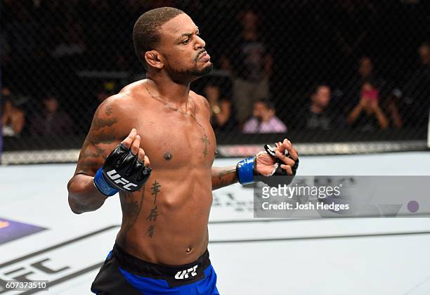 Michael Johnson celebrates his knockout victory over Dustin Poirier in their lightweight bout during the UFC Fight Night event at State Farm Arena on...