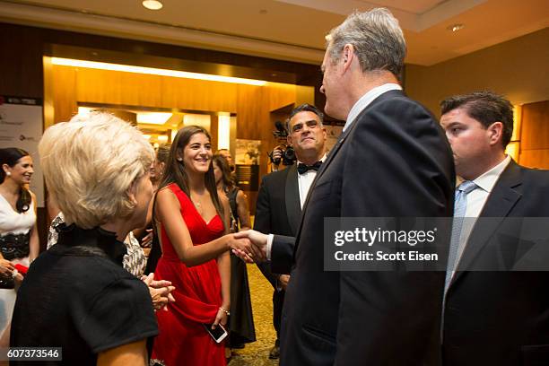Massachusetts Governor Charlie Baker shakes hands with Nicole Kouri at the 7th annual Milagros Para Ninos Gala benefitting Boston Children's Hospital...