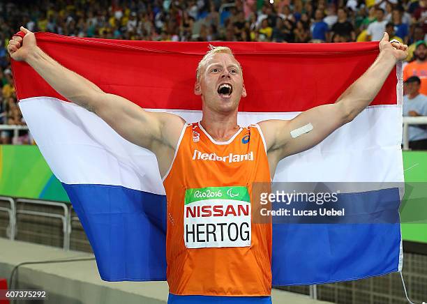 Ronald Hertog of the Netherlands celebrates after completing the Men's Long Jump - T44 Final during day 10 of the Rio 2016 Paralympic Games at the...