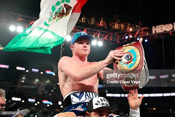 Canelo Alvarez celebrates after knocking out Liam Smith, lower, during the WBO Junior Middleweight World fight at AT&T Stadium on September 17, 2016...