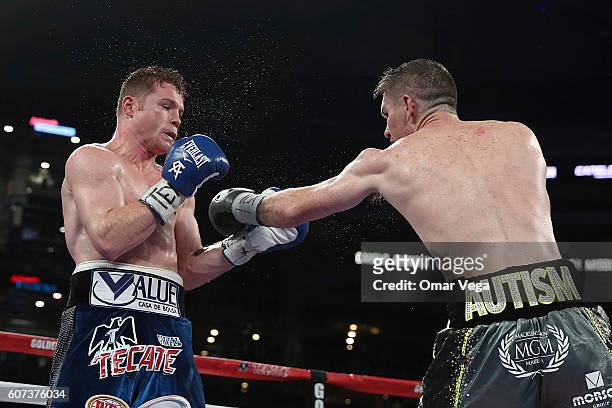 Liam Smith, right, fights Canelo Alvarez, left, during the WBO Junior Middleweight World fight at AT&T Stadium on September 17, 2016 in Arlington,...